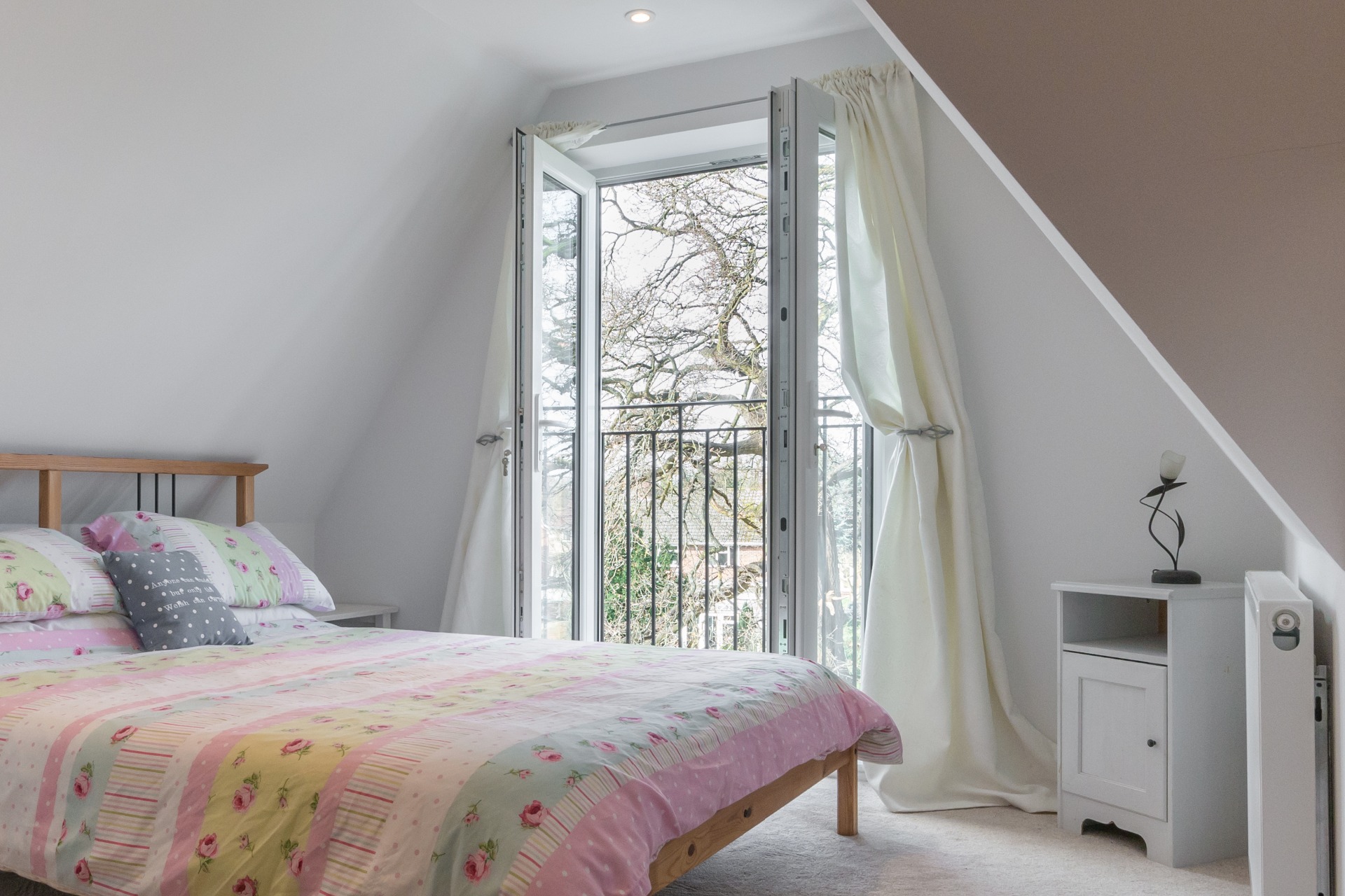 Bedroom in loft conversion with balconet